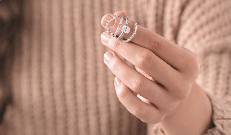 woman holding rings